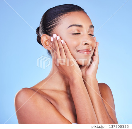 Woman, natural beauty and smile with skincare, face cleaning and skin glow in studio. Facial, female model and cosmetics with dermatology, self care and collagen treatment with blue background 137500536