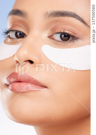 Portrait, woman and eye patch for skincare and face health, dermatology and self care shine on studio background. Beauty, person and facial product with collagen mask, wellness and glow with zoom 137500560