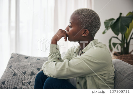 Woman, thinking and depression on sofa for sad memory, mental health risk and anxiety of debt. Stress, worry and lonely african person remember trauma of abuse, broken heart or doubt decision at home 137500731