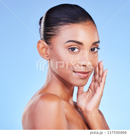 Beauty, wellness and skincare with portrait of woman in studio for cosmetics, dermatology and facial. Glow, self care and health with person on blue background for spa treatment, grooming and makeup Beauty, wellness and skincare with portrait of woman in studio for cosmetics, dermatology and facial. Glow, self care and health with person on blue background for spa treatment, grooming and makeup 137500866