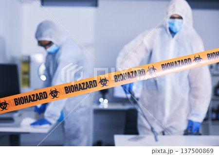 Hazard, tape and people in danger working with toxic, biology or team disinfect dangerous bacteria or health emergency. Biohazard, protection and medical staff in hazmat suit cleaning for bio safety Hazard, tape and people in danger working with toxic, biology or team disinfect dangerous bacteria or health emergency. Biohazard, protection and medical staff in hazmat suit cleaning for bio safety 137500869