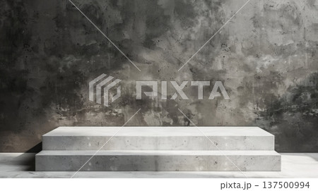 A concrete step is positioned in front of a solid concrete wall, creating a stark urban scene. 137500994