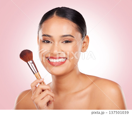 Woman, makeup and portrait of brush in studio for beauty, skincare and aesthetic of face on pink background. Happy model, dermatology and cosmetics tools for foundation, facial powder and makeover Woman, makeup and portrait of brush in studio for beauty, skincare and aesthetic of face on pink background. Happy model, dermatology and cosmetics tools for foundation, facial powder and makeover 137501039