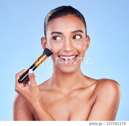 Beauty, face and woman with makeup brush in studio for powder, cosmetic or application on blue background. Foundation, skincare and lady model with cheek tools for contour, cover or facial treatment Beauty, face and woman with makeup brush in studio for powder, cosmetic or application on blue background. Foundation, skincare and lady model with cheek tools for contour, cover or facial treatment 137501174