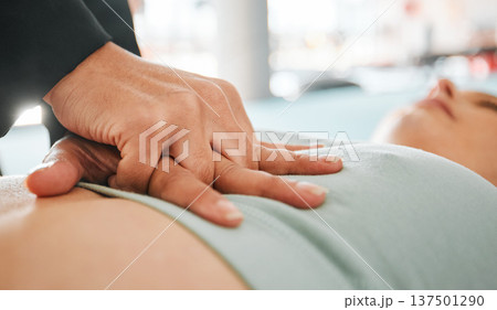 First aid, cpr and medical with hands on chest of patient for safety, heart rate and emergency service. Healthcare, wellness and support with closeup of people for accident, lifeguard and helping 137501290