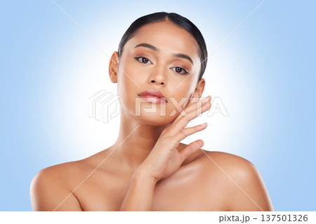 Beauty, makeup and portrait with face of woman in studio for cosmetics, glow and self care. Health, skincare and dermatology treatment with person on blue background for facial, salon and cosmetology Beauty, makeup and portrait with face of woman in studio for cosmetics, glow and self care. Health, skincare and dermatology treatment with person on blue background for facial, salon and cosmetology 137501326