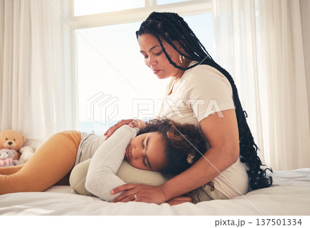Family, mother and sad child for support lying on lap, relax and comfort in bedroom of house for depression. Love, woman and girl show care together, rest and bonding with peace on bed in apartment Family, mother and sad child for support lying on lap, relax and comfort in bedroom of house for depression. Love, woman and girl show care together, rest and bonding with peace on bed in apartment 137501334