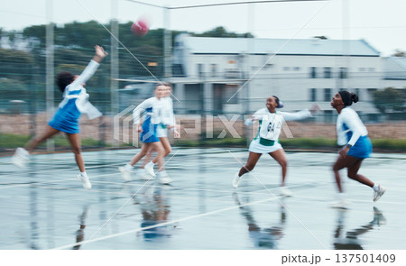 Sports, netball team player and women running, cardio or challenge for ball, competition and play active game. Motion blur, outdoor tournament and group workout, exercise and player training together Sports, netball team player and women running, cardio or challenge for ball, competition and play active game. Motion blur, outdoor tournament and group workout, exercise and player training together 137501409