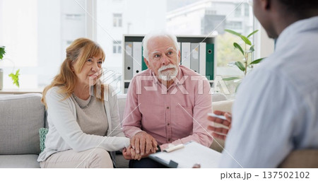 Counseling, support and senior couple with therapist in consultation for help, talk or crisis guidance. Therapy, depression and old people holding hands consulting marriage or mental health expert Counseling, support and senior couple with therapist in consultation for help, talk or crisis guidance. Therapy, depression and old people holding hands consulting marriage or mental health expert 137502102