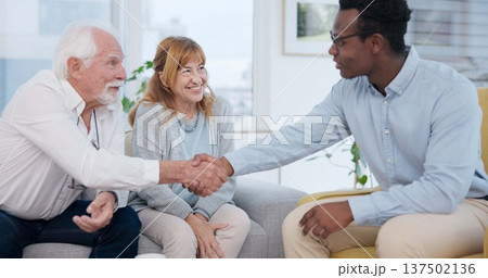 Senior, couple and handshake for life insurance planning and investment at a meeting. Finance, shaking hands and agreement deal for accounting and retirement budget for income savings with thank you Senior, couple and handshake for life insurance planning and investment at a meeting. Finance, shaking hands and agreement deal for accounting and retirement budget for income savings with thank you 137502136