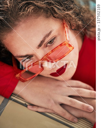 Face, fashion and sunglasses with a woman hipster relaxing closeup with trendy style for thinking. Summer, idea and outdoors with a young female person in eyewear looking bored while waiting alone 137502189