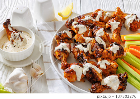Alabama white sauce chicken wings with vegetables Alabama white sauce chicken wings with vegetables 137502276