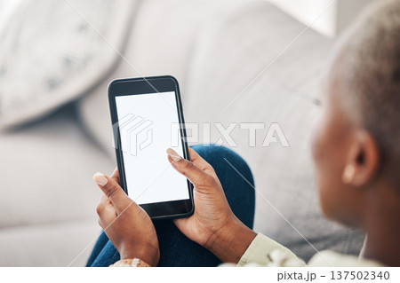 Hands of woman on sofa with phone screen, scroll and social media, message or video online. Technology, internet and girl on couch with smartphone, digital app and mockup for website or platform. Hands of woman on sofa with phone screen, scroll and social media, message or video online. Technology, internet and girl on couch with smartphone, digital app and mockup for website or platform. 137502340