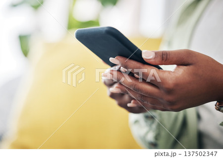 Hands of woman on sofa with phone, typing and checking social media, message or video online. Technology, internet and girl on couch with smartphone, digital app and like for viral content at home. Hands of woman on sofa with phone, typing and checking social media, message or video online. Technology, internet and girl on couch with smartphone, digital app and like for viral content at home. 137502347