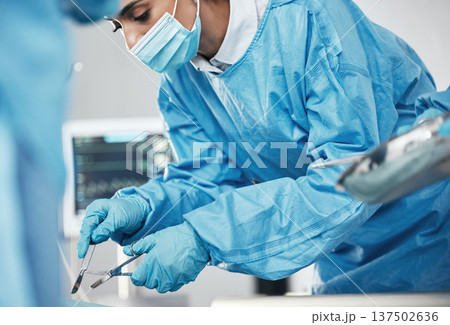 Healthcare, medical and doctor in surgery with surgical tools or equipment in the hospital. Surgeon, cardiology and woman cardiologist doing heart operation or procedure on patient in medicare clinic Healthcare, medical and doctor in surgery with surgical tools or equipment in the hospital. Surgeon, cardiology and woman cardiologist doing heart operation or procedure on patient in medicare clinic 137502636