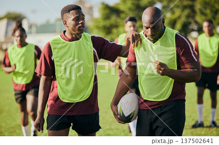 Sports, fitness and men for rugby training, workout and exercise on grass field for competition. Teamwork, collaboration and athletes with ball for support in practice, match and game for challenge Sports, fitness and men for rugby training, workout and exercise on grass field for competition. Teamwork, collaboration and athletes with ball for support in practice, match and game for challenge 137502641