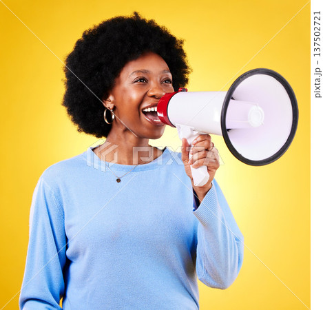 Happy woman, loudspeaker or megaphone to shout in studio for voice or announcement. African model person with speaker for broadcast message, breaking news or protest communication or speech Happy woman, loudspeaker or megaphone to shout in studio for voice or announcement. African model person with speaker for broadcast message, breaking news or protest communication or speech 137502721