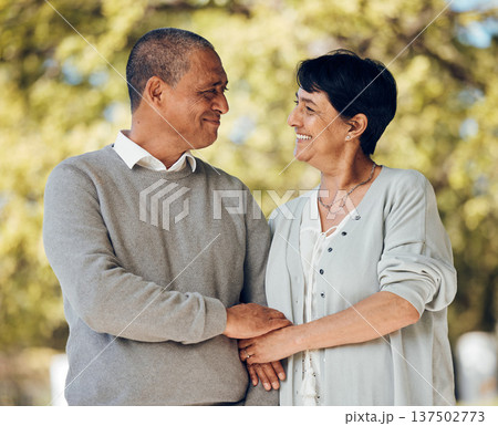 Mature couple in park, love and smile, support and trust with bonding and marriage. Life partner, retirement together and romance, people are happy outdoor with healthy relationship and care Mature couple in park, love and smile, support and trust with bonding and marriage. Life partner, retirement together and romance, people are happy outdoor with healthy relationship and care 137502773