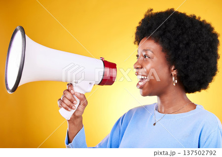 Happy black woman, profile and megaphone in advertising or marketing against a yellow studio background. African female person, smile or voice with loudspeaker in announcement, alert or discount sale 137502792