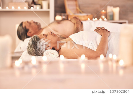 Relax, massage and couple for facial in spa for holiday, vacation and anniversary for wellness. Love, luxury hotel resort and mature man and woman in salon for beauty, therapy and skincare treatment 137502804