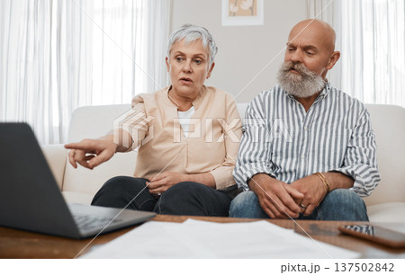 Budget, finance and senior couple with laptop planning financial investments, mortgage or tax papers. Elderly woman apeaking of bills, debt and pension fund on bank statement with an old man at home 137502842