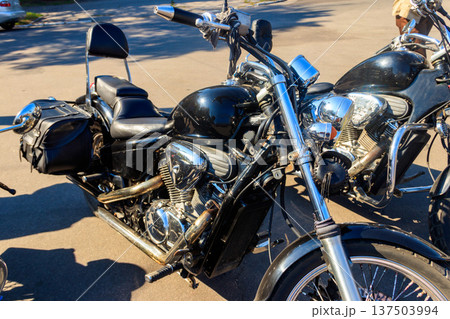 Modern motorcycle parked on a city street 137503994