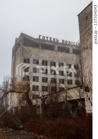Abandoned building of Polissya hotel in the ghost town Pripyat in Chernobyl Exclusion Zone, Ukraine. Inscription in Ukrainian: Hotel Polissya Abandoned building of Polissya hotel in the ghost town Pripyat in Chernobyl Exclusion Zone, Ukraine. Inscription in Ukrainian: Hotel Polissya 137504043