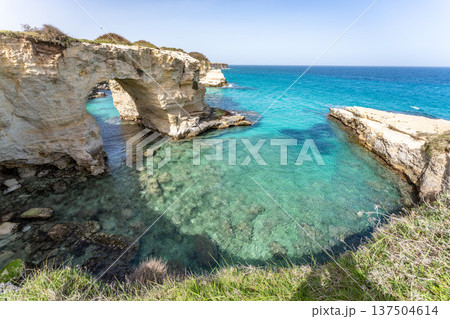Torre Sant'Andrea, Melendugno, Italy. Natural rock arches, Arco degli Innamorati Torre Sant'Andrea, Melendugno, Italy. Natural rock arches, Arco degli Innamorati 137504614