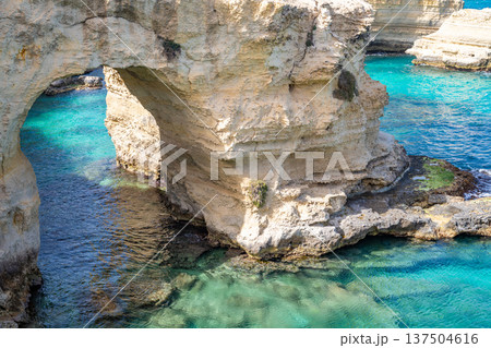 Torre Sant'Andrea, Melendugno, Italy. Natural rock arches, Arco degli Innamorati Torre Sant'Andrea, Melendugno, Italy. Natural rock arches, Arco degli Innamorati 137504616