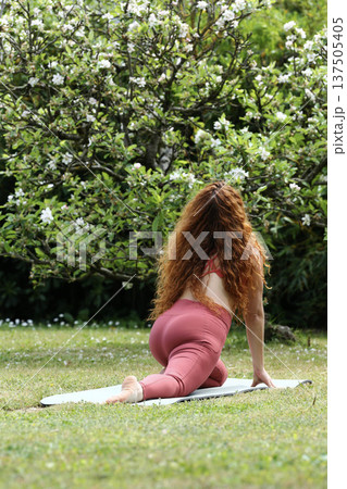Healthy Lifestyle Woman Practicing Yoga in Nature Healthy Lifestyle Woman Practicing Yoga in Nature 137505405