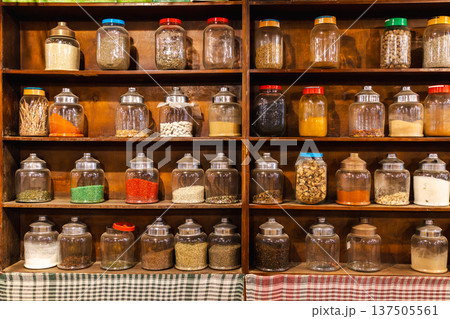 Traditional bedouin herbal pharmacy shelves with jars of medicinal herbs tea and natural remedies 137505561