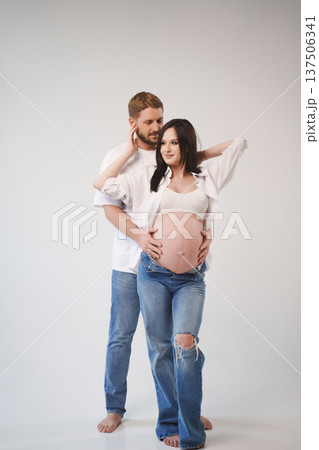 Couple sharing a tender moment before baby arrives 137506341
