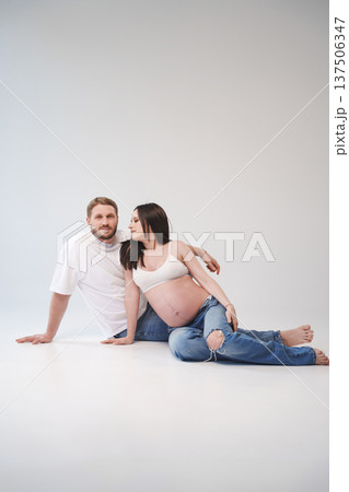 Couple celebrating pregnancy with joyful love at studio Couple celebrating pregnancy with joyful love at studio 137506347