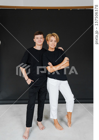 Modeling session with two people on a black background in a studio 137506378