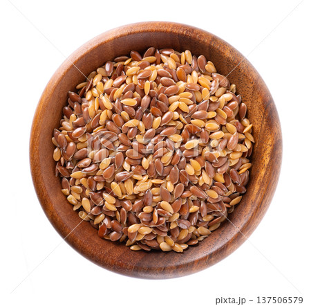 Flax seed mix isolated on white background. Golden and brown linseed or flaxseed in wooden bowl. Clipping path. Top view. Flax seed mix isolated on white background. Golden and brown linseed or flaxseed in wooden bowl. Clipping path. Top view. 137506579