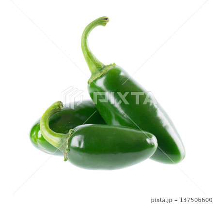 Fresh jalapeno pepper isolated on white background. Slices of green hot serrano pepper. Clipping path. Fresh jalapeno pepper isolated on white background. Slices of green hot serrano pepper. Clipping path. 137506600