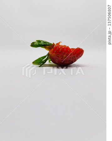 Bitten Strawberry isolated on a white background. Fresh red berry 137506807