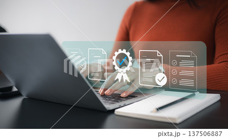 Quality Assurance and ISO Certification Concept with Business Woman Working on Laptop Quality Assurance and ISO Certification Concept with Business Woman Working on Laptop 137506887