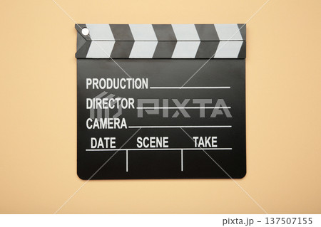 One movie clapper on beige background. Film industry One movie clapper on beige background. Film industry 137507155