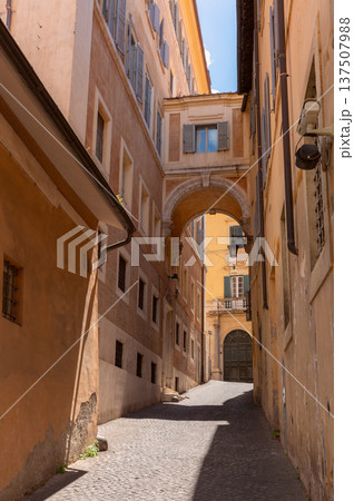 Narrow historic street with arch passage in Rome Italy Narrow historic street with arch passage in Rome Italy 137507988