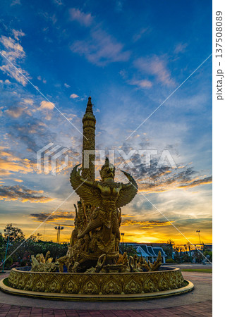 Stunning sky at sunrise above Golden Garuda Monument 137508089