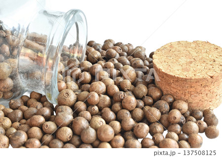 Allspice peas in a glass container. Allspice peas in a glass container. 137508125