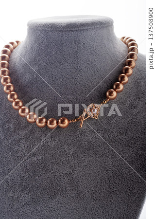 author handmade golden  pearls necklace presented on maneken. fashion and jewelry concept. macro shot 137508900