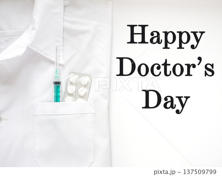 White medical coat and Happy Doctor's Day text White medical coat and Happy Doctor's Day text 137509799