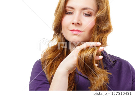 Woman with long hair shows healthy ends Woman with long hair shows healthy ends 137510451