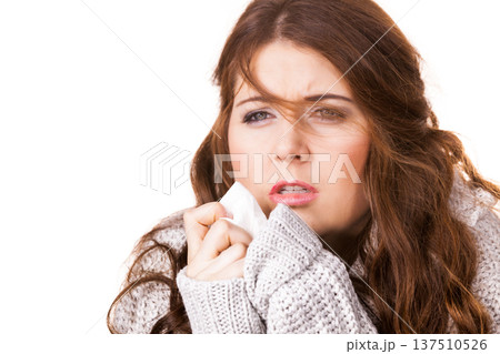 Sick freezing woman sneezing in tissue Sick freezing woman sneezing in tissue 137510526