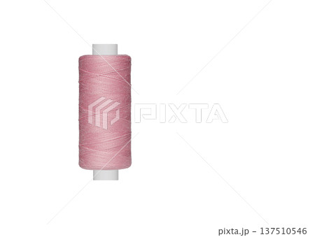 pink spool of sewing thread isolated on white background 137510546