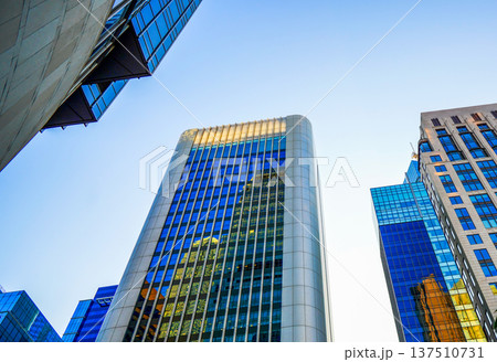 Skyscrapers tower glass buildings in sunlight. Facade office buildings. High-rise bank building. Skyscrapers tower glass buildings in sunlight. Facade office buildings. High-rise bank building. 137510731