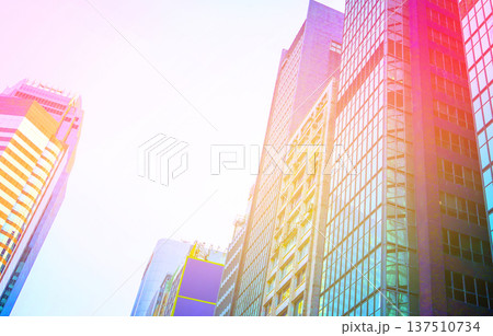 Skyscrapers in bright glass exteriors sunlight on sunset. Modern facade office buildings 137510734