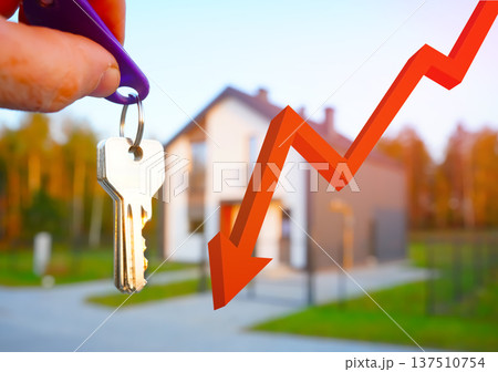 Concept of declining real estate prices or housing affordability. Buying home. Keys house Concept of declining real estate prices or housing affordability. Buying home. Keys house 137510754